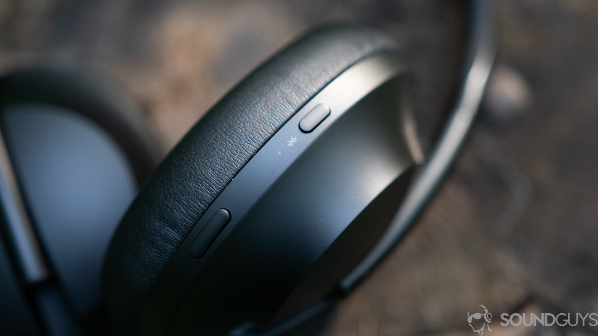 Bose Noise Canceling Headphones 700-2-2 The playback button and power button on the earcup of the Bose Noise Cancelling Headphones 700.