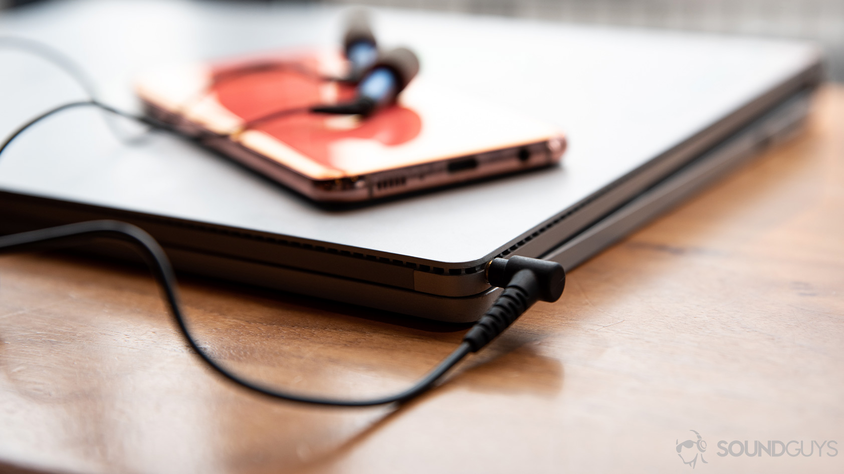 Etymotic ER2SE-headphone jack earbuds A picture of the Etymotic ER2SE wired earbuds connected to a Microsoft Surface Book laptop with a Samsung Galaxy S10e on top of it.