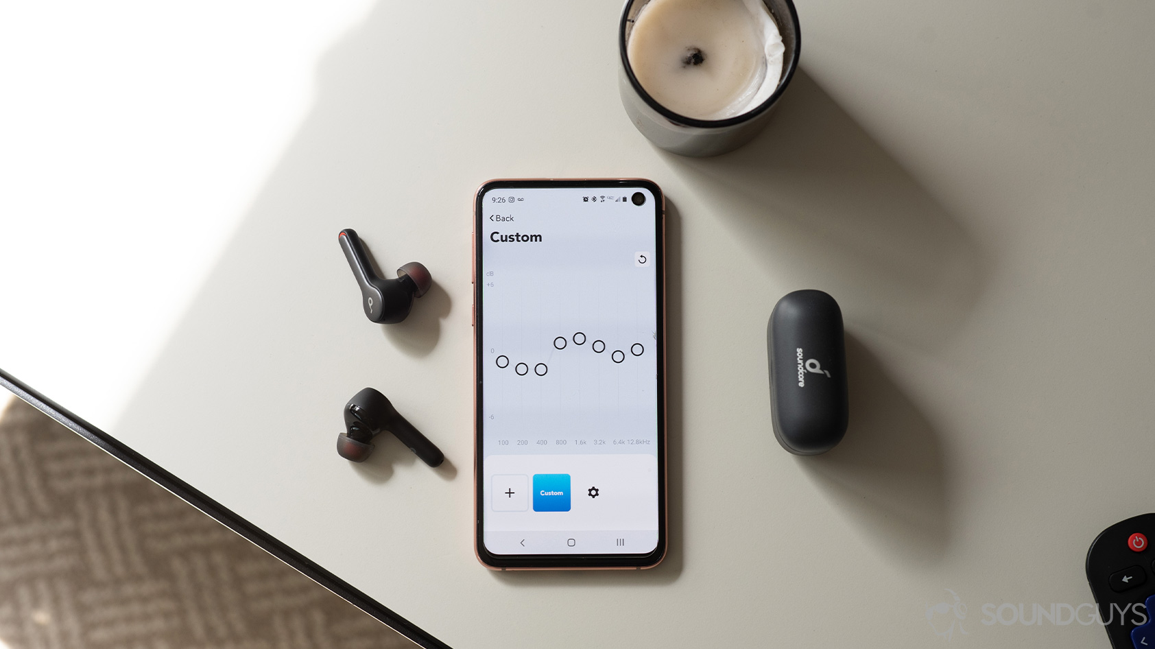 Anker SoundCore Liberty Air 2-true wireless earbuds mobile app equalizer An aerial picture of the Anker SoundCore Liberty Air 2 true wireless earbuds next to a Samsung Galaxy S10e with the SoundCore mobile app equalizer open.