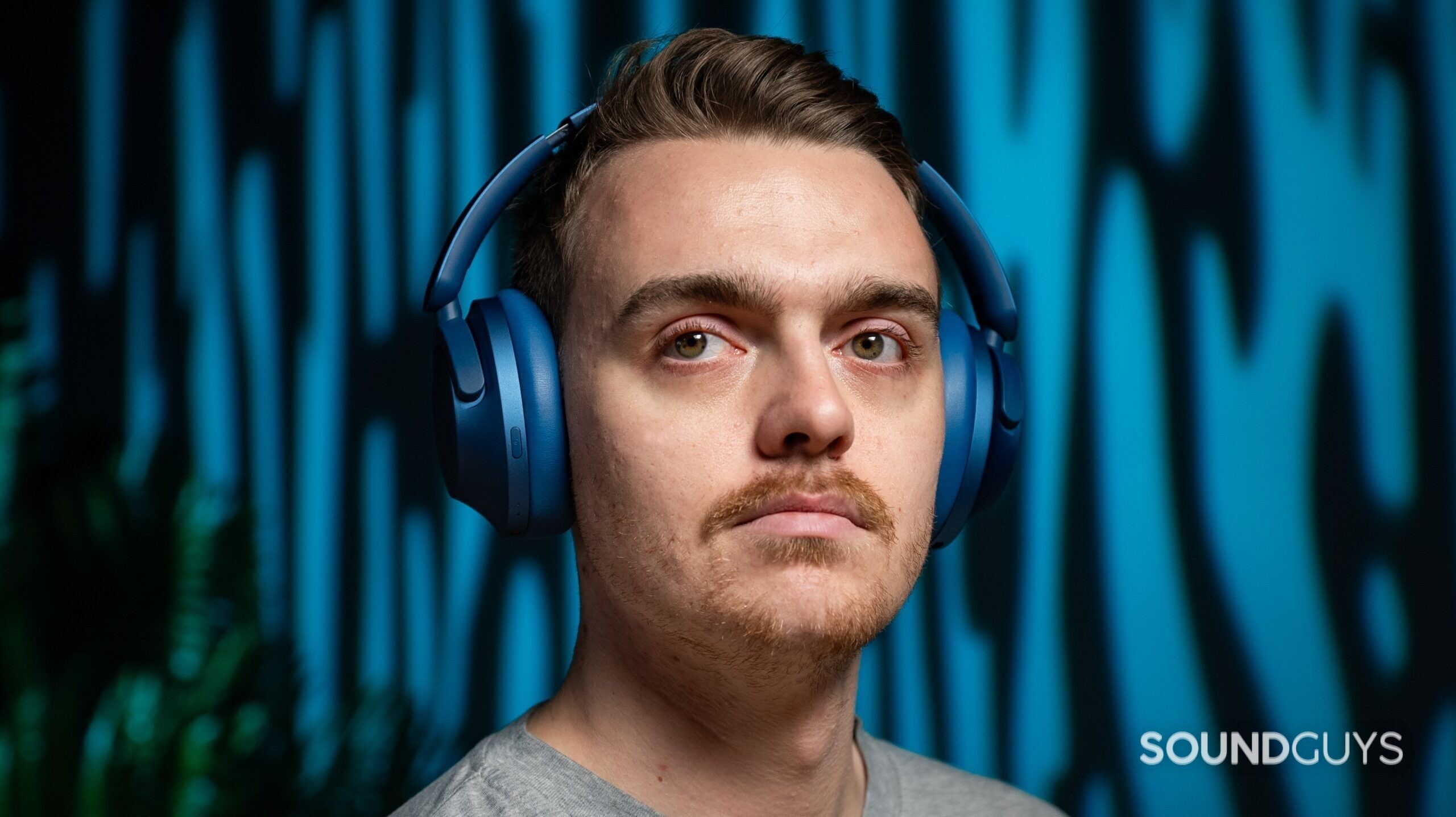 1MORE SonoFlow Headphones Model Image #1 A man wearing the 1MORE SonoFlow headphones