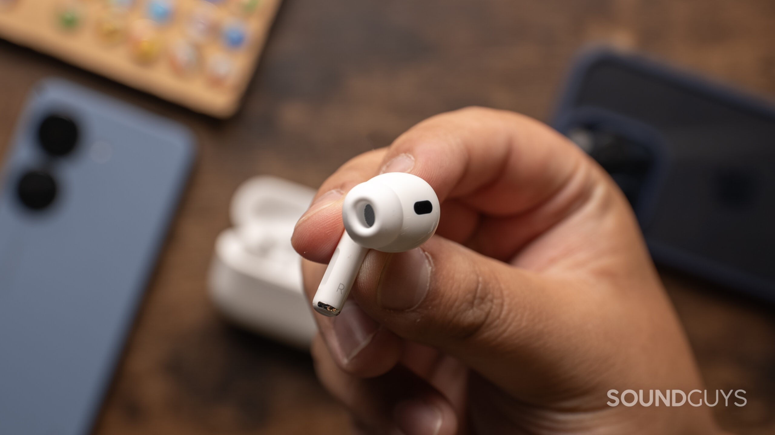AirPods-Pro-2nd-Generation-USB-C-ear-tip A hand holds the Apple AirPods Pro (2nd generation) bud showing the ear tips.
