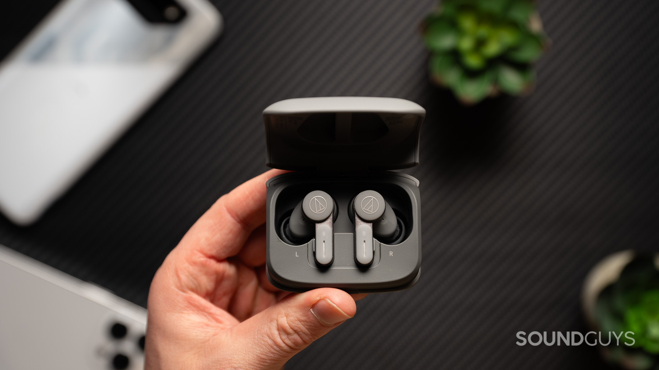 Audio Technica ATH-TWX7 hero 3 Audio-Technica ATH-TWX7 earbuds inside their charging case.